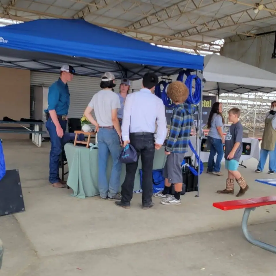 Families visiting the Oh So Good booth at the junior fair